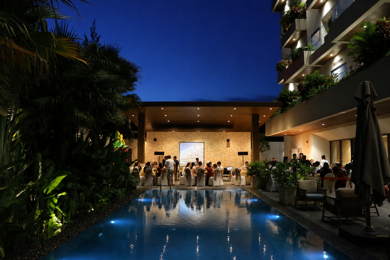 Elegant poolside dining at dusk